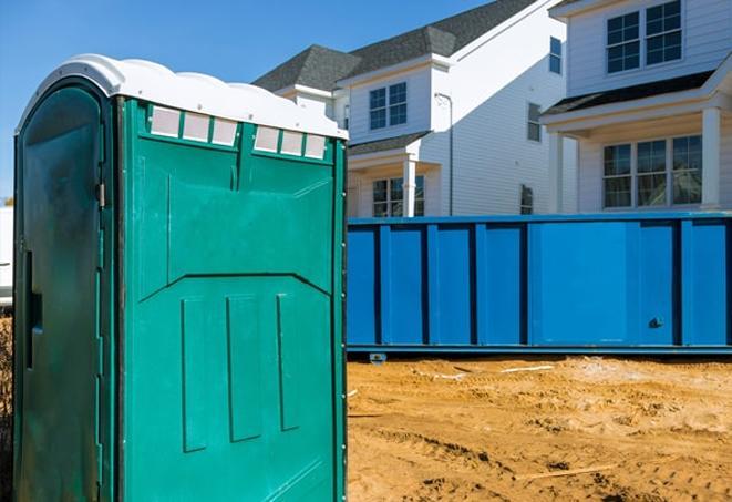 a row of portable toilets at a job site